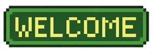 A green rectangular sign with the word WELCOME written in bold, yellow, pixelated letters, resembling a retro video game style.
